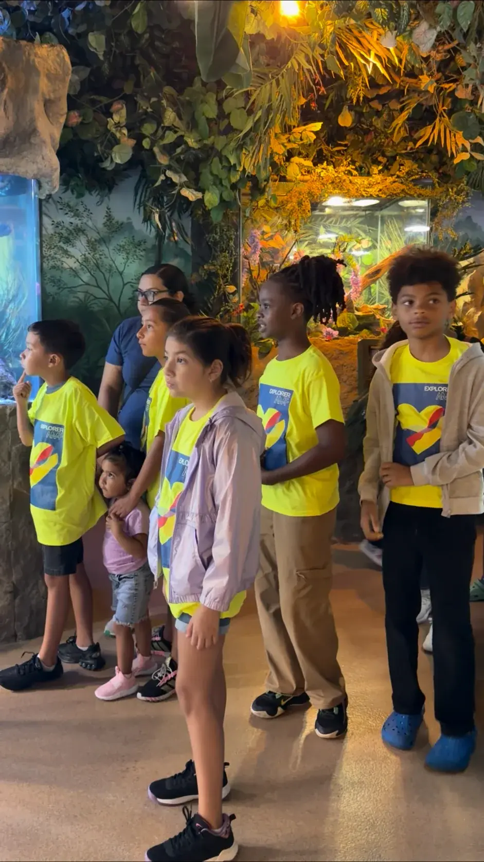 Children participating together in an Autism Meets Faith Explorers aquarium experience.